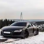 Luxury Black Sport Coupe Parking Snowy Road Forest
